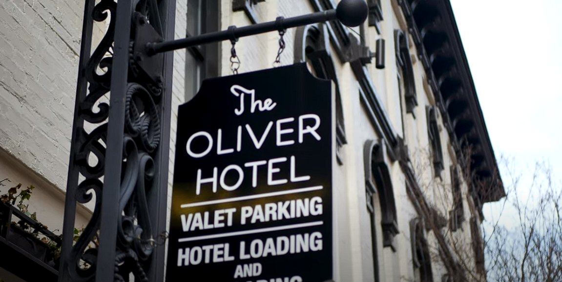 The Oliver Hotel exterior view with a focus on signage