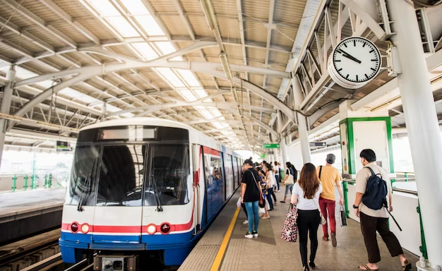 Bustling Train Station with the Train and Commuters